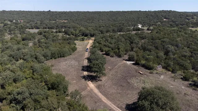 an aerial view of a house with mountain view