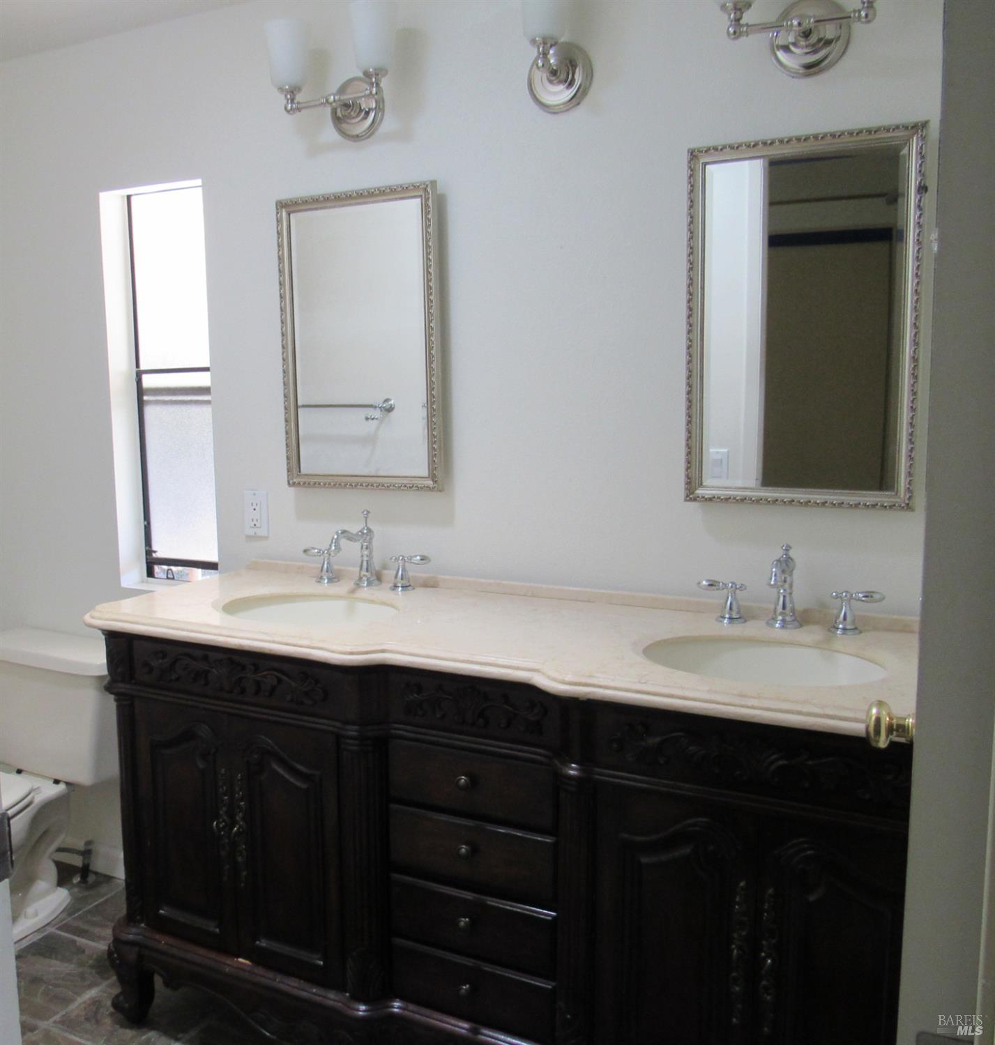 31 Ramon Street Sonoma, CA 95476 - Photo 18 of 24 a bathroom with a double vanity sink and a mirror