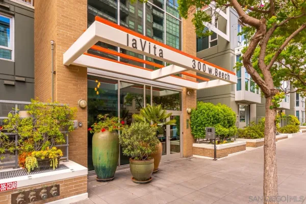 front view of a building with potted plants