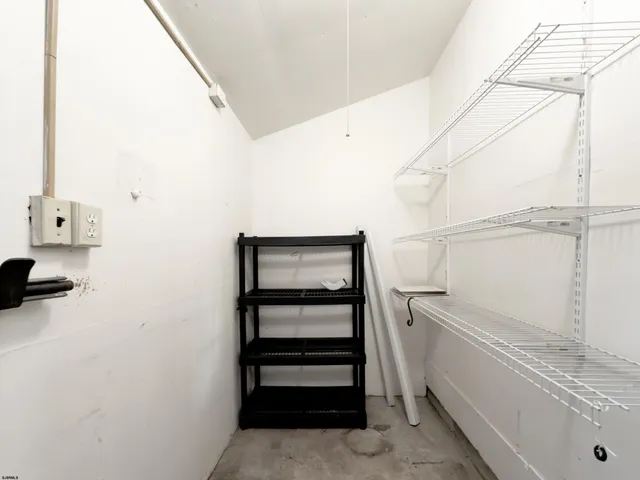 a view of a porch with a floor to ceiling window next to a yard
