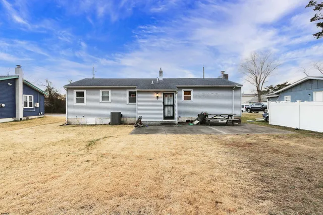 a view of a backyard of the house