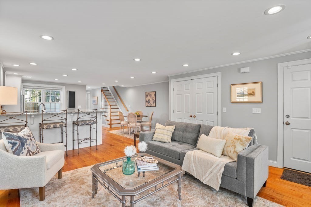 27 Warren Street, Unit 1 Newburyport, MA 01950 - Photo 11 of 32 a living room with furniture kitchen view and a table