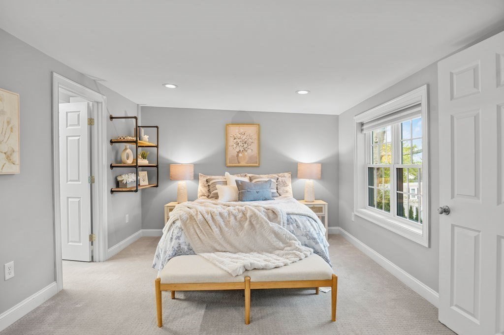 27 Warren Street, Unit 1 Newburyport, MA 01950 - Photo 29 of 32 a bedroom with a bed and a window