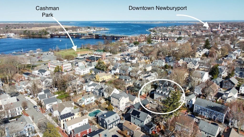 27 Warren Street, Unit 1 Newburyport, MA 01950 - Photo 5 of 32 an aerial view of a house with a yard and lake view