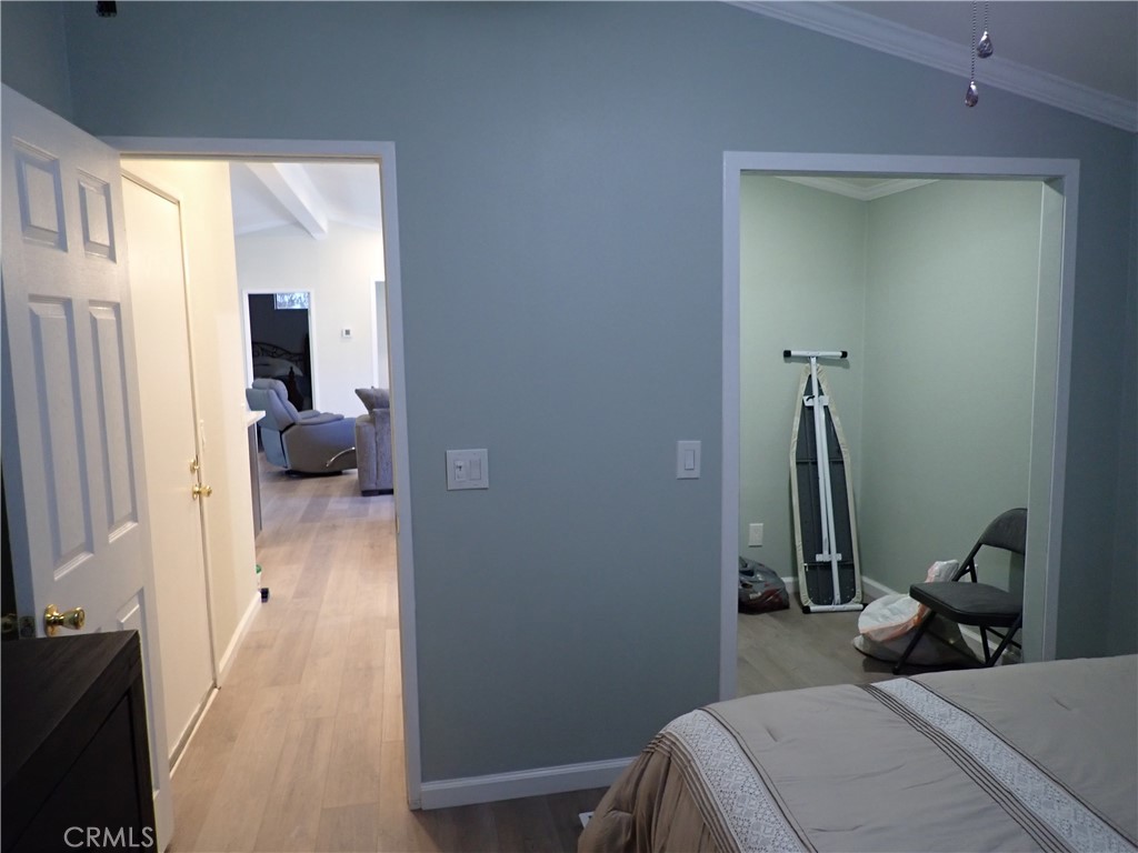 27250 Murrieta Road, Unit 386 Menifee, CA 92586 - Photo 16 of 32 a view of a bedroom from a hallway