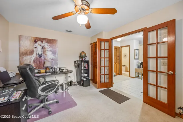 a view of a livingroom with furniture and a window