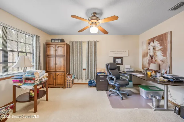 a work room with furniture and windows