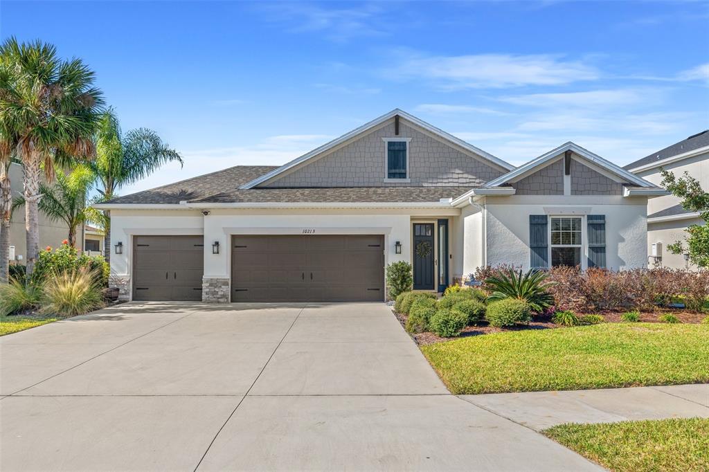 10213 Eaves Bend Way Palmetto, FL 34221 - Photo 1 of 1 front view of a house with a yard