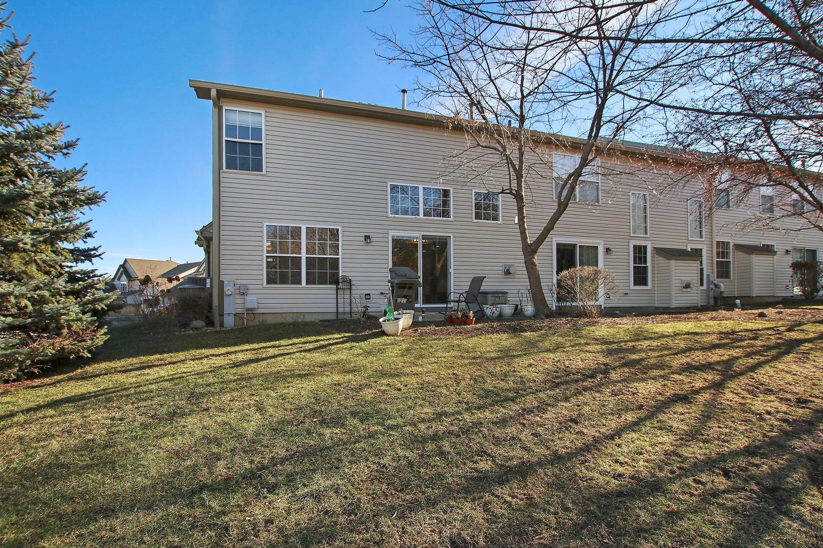 521 Willow Way Lindenhurst, IL 60046 - Photo 20 of 24 a house that has a tree in front of it