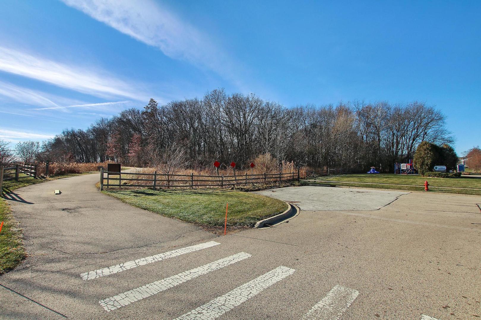 521 Willow Way Lindenhurst, IL 60046 - Photo 22 of 24 a view of a playground with houses