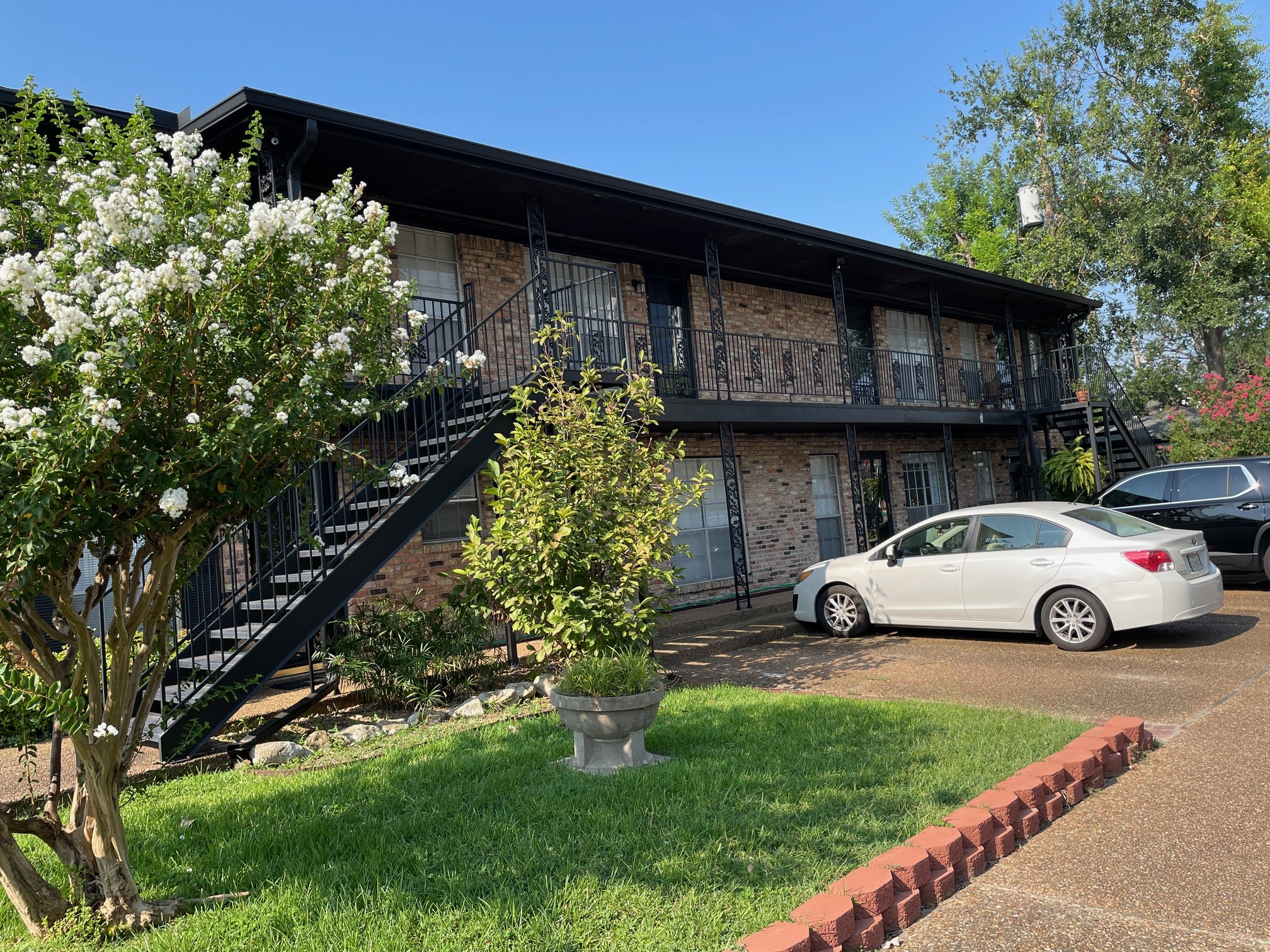 1500 Woodhead Street, Unit 2 Houston, TX 77019 - Photo 1 of 20 a view of street with parked cars