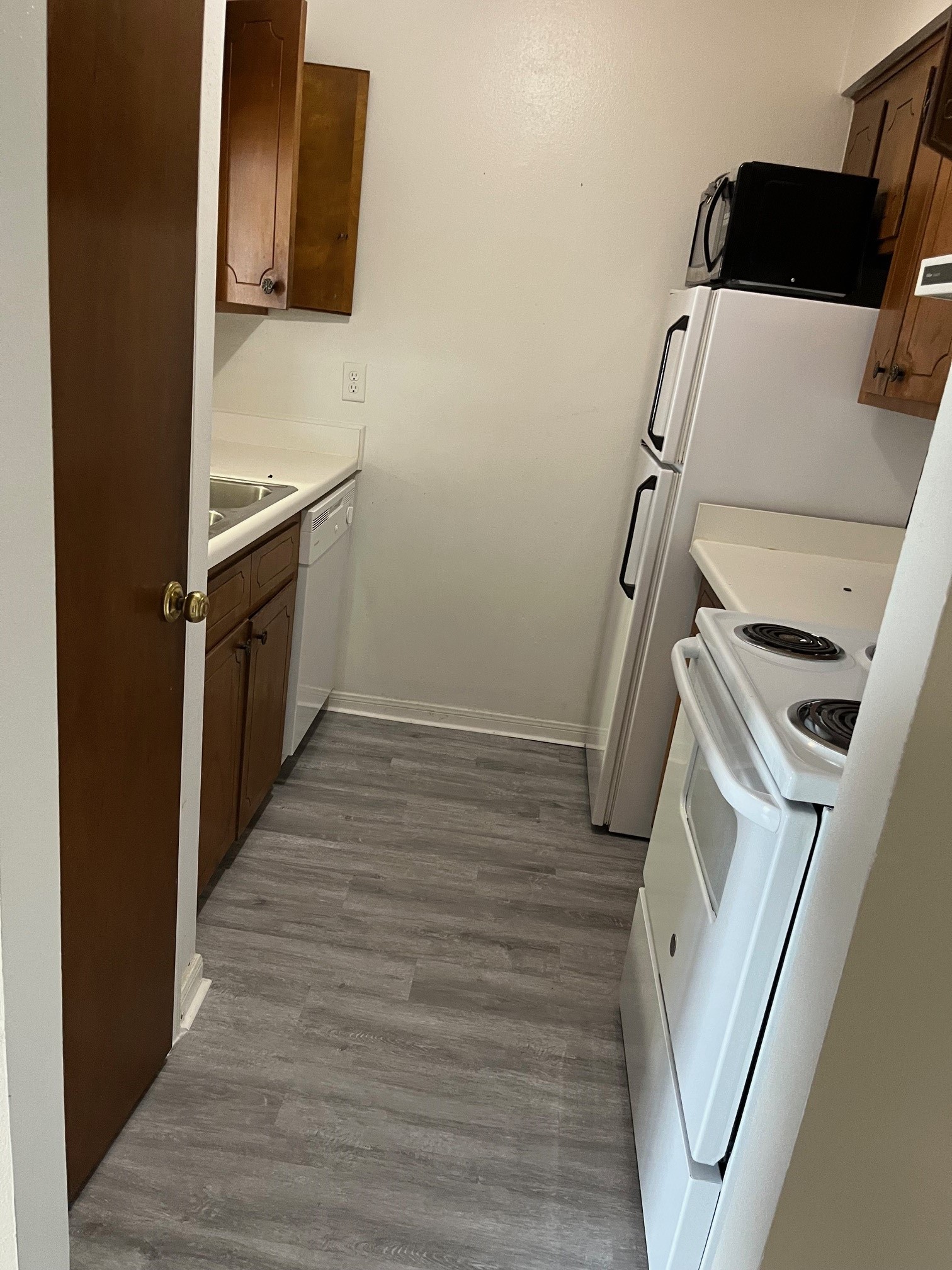 1500 Woodhead Street, Unit 2 Houston, TX 77019 - Photo 11 of 20 a view of a kitchen with fridge and wooden floor
