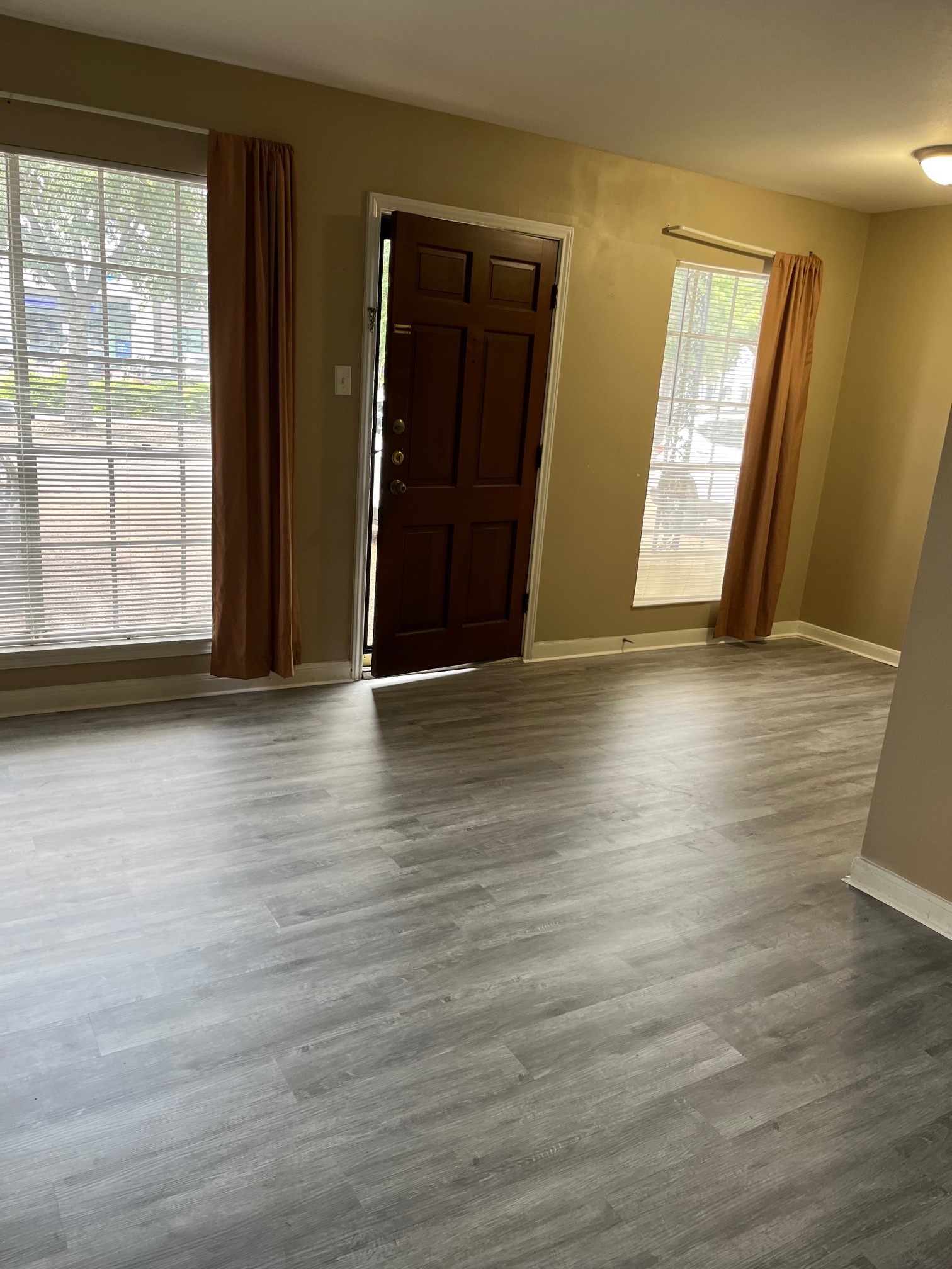 1500 Woodhead Street, Unit 2 Houston, TX 77019 - Photo 6 of 20 an empty room with wooden floor and windows