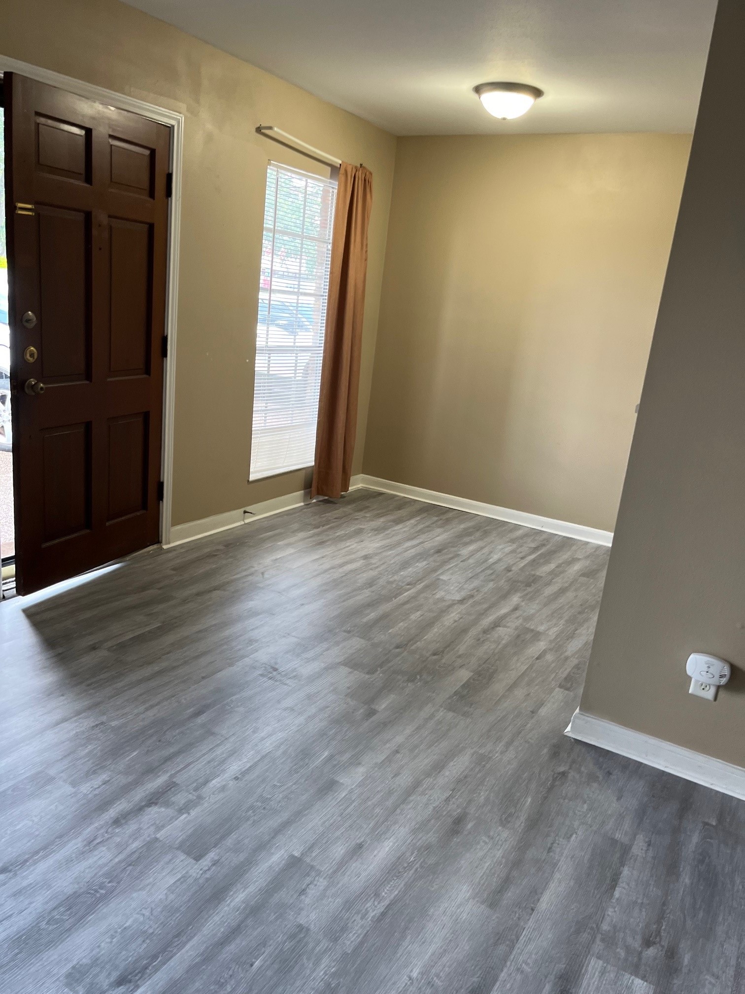 1500 Woodhead Street, Unit 2 Houston, TX 77019 - Photo 7 of 20 a view of an empty room with wooden floor and a window