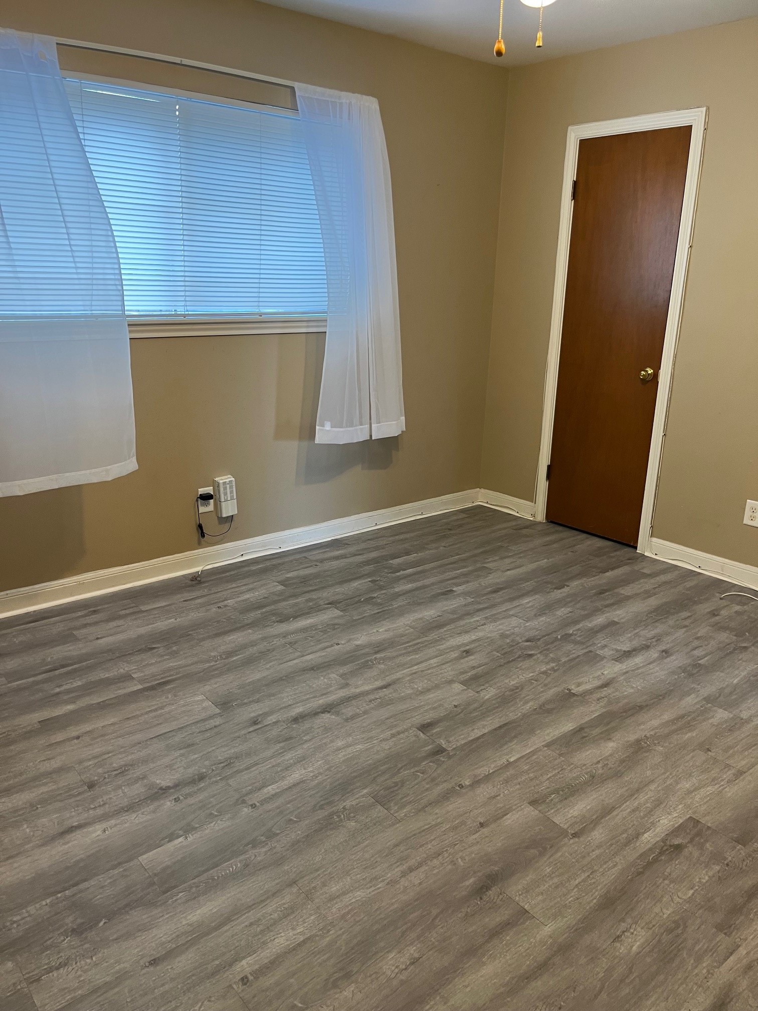 1500 Woodhead Street, Unit 2 Houston, TX 77019 - Photo 10 of 20 an empty room with wooden floor and windows