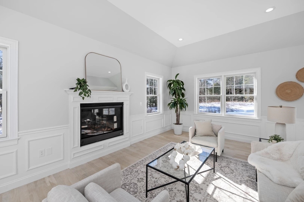 Lot 6 Osprey Court Rowley, MA 01969 - Photo 4 of 25 a living room with furniture a window and a fireplace