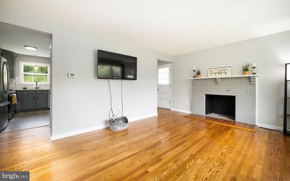 5239 Reels Mill Road Frederick, MD 21704 - Photo 13 of 24 Living room off of kitchen - nice hardwoods