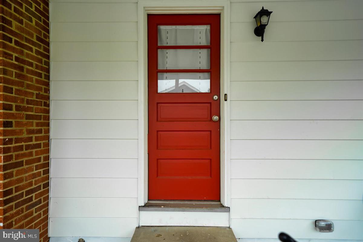 5239 Reels Mill Road Frederick, MD 21704 - Photo 4 of 24 Two steps into house from side carport