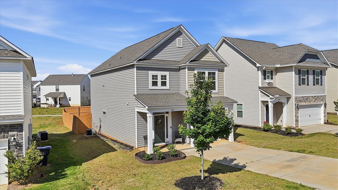 403 Seaborn Circle Pendleton, SC 29670 - Photo 3 of 47 This modern home features gray siding, a welcoming porch, and an attached garage.