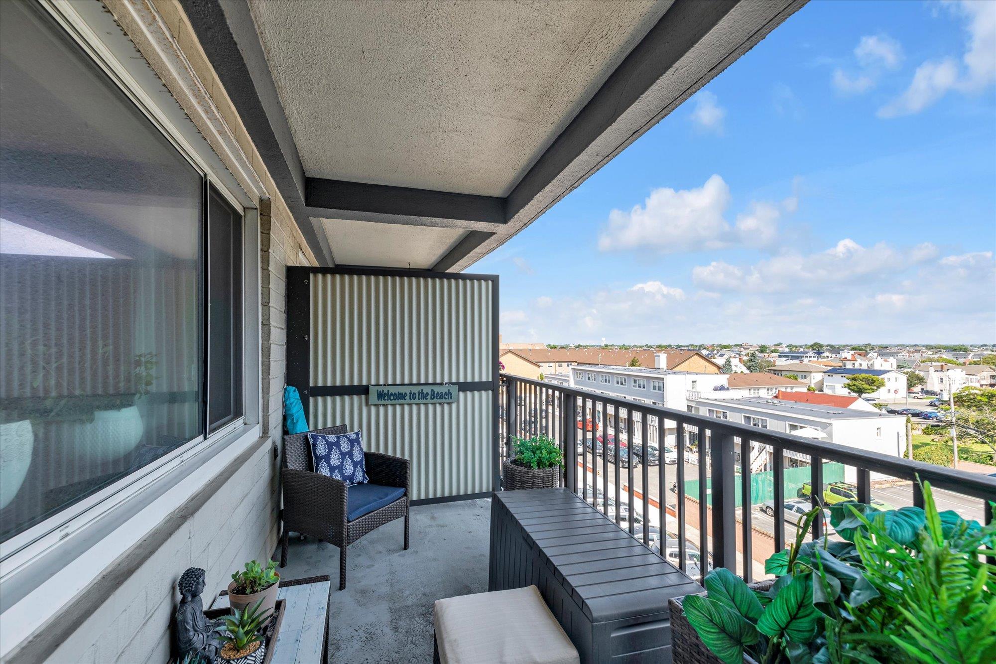 a balcony with furniture and city view