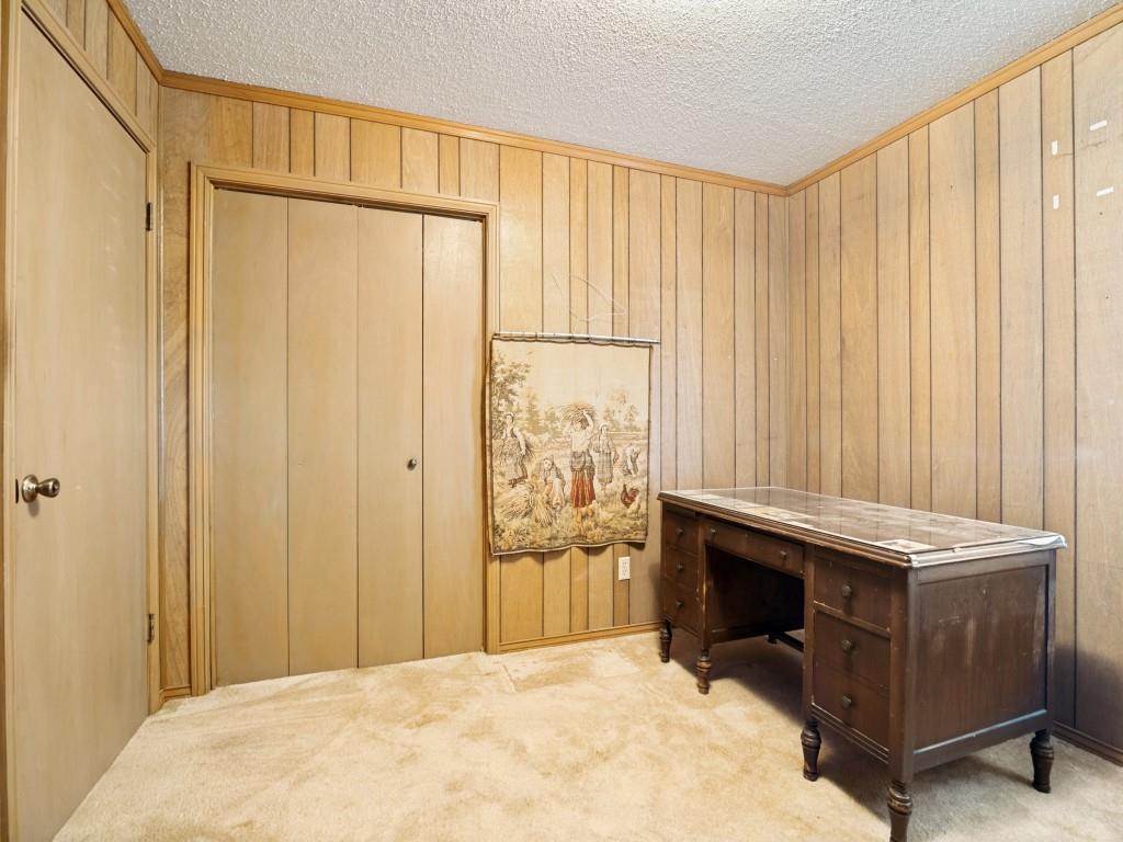 1081 Wright Street Terrell, TX 75160 - Photo 22 of 29 Room featuring wood paneling on walls with coordinated wood trim