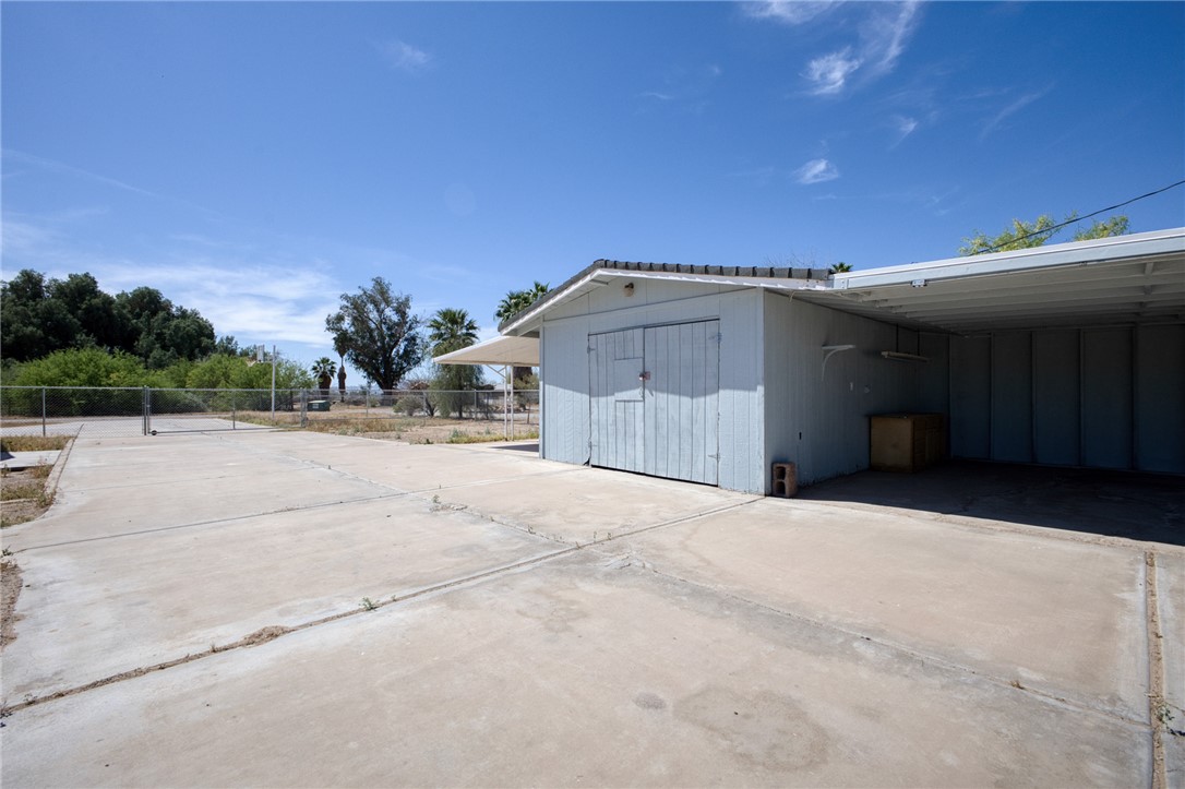 2053 Regents Road Mohave Valley, AZ 86440 - Photo 41 of 65 The property features a dedicated storage shed and a covered carport area