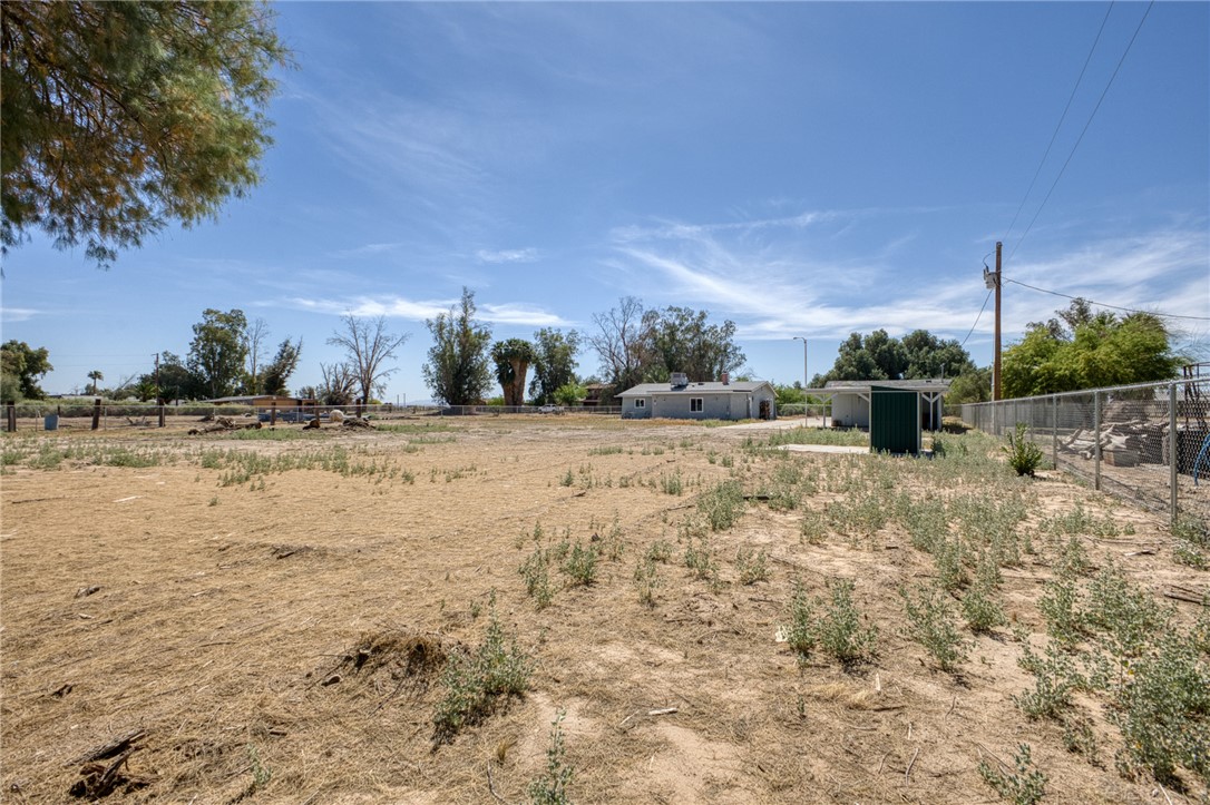 2053 Regents Road Mohave Valley, AZ 86440 - Photo 48 of 65 The property features an extensive outdoor area with visible fencing and a clear view of the open sky