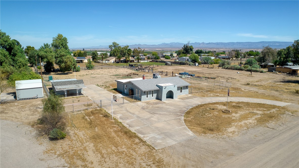2053 Regents Road Mohave Valley, AZ 86440 - Photo 4 of 65 The property features a concrete driveway and an attached garage