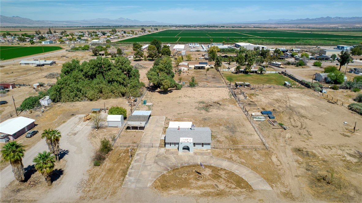 2053 Regents Road Mohave Valley, AZ 86440 - Photo 63 of 65 Aerial view of the property featuring a main building with a gray roof and a semi-circular driveway