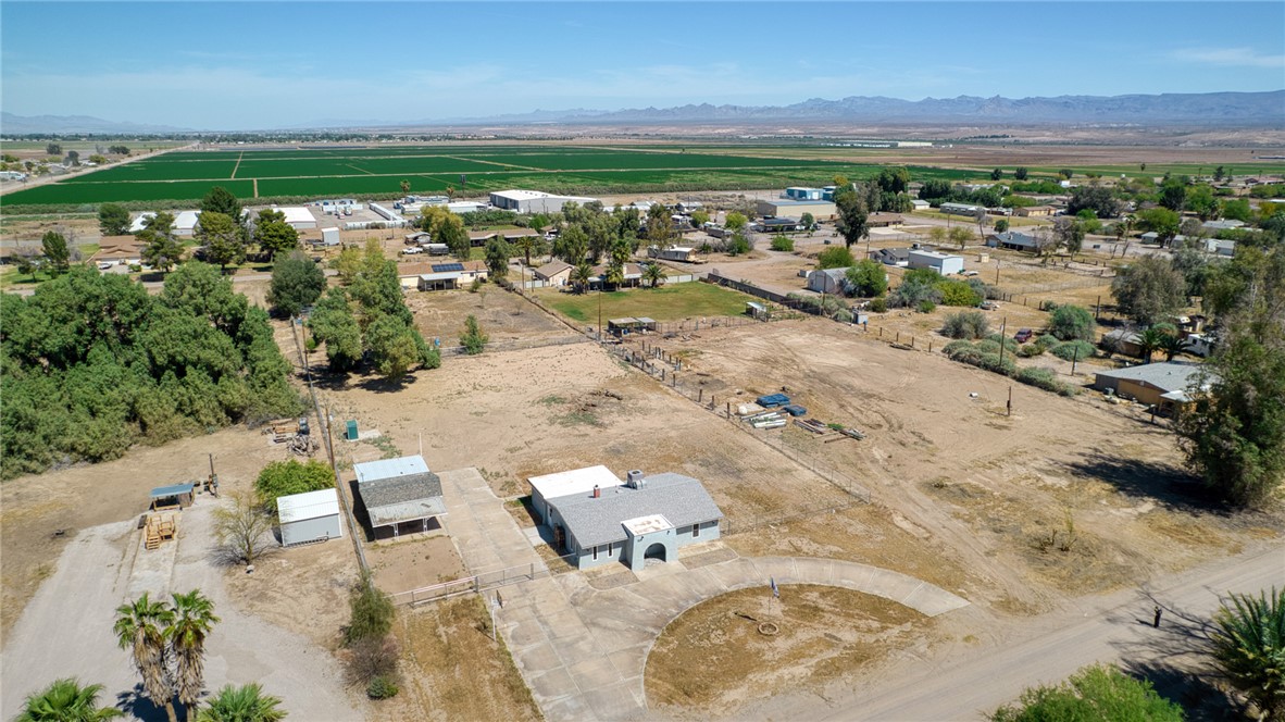 2053 Regents Road Mohave Valley, AZ 86440 - Photo 64 of 65 Aerial view of the property and its expansive surroundings, featuring a main residence with a curved driveway, and several ancillary structures