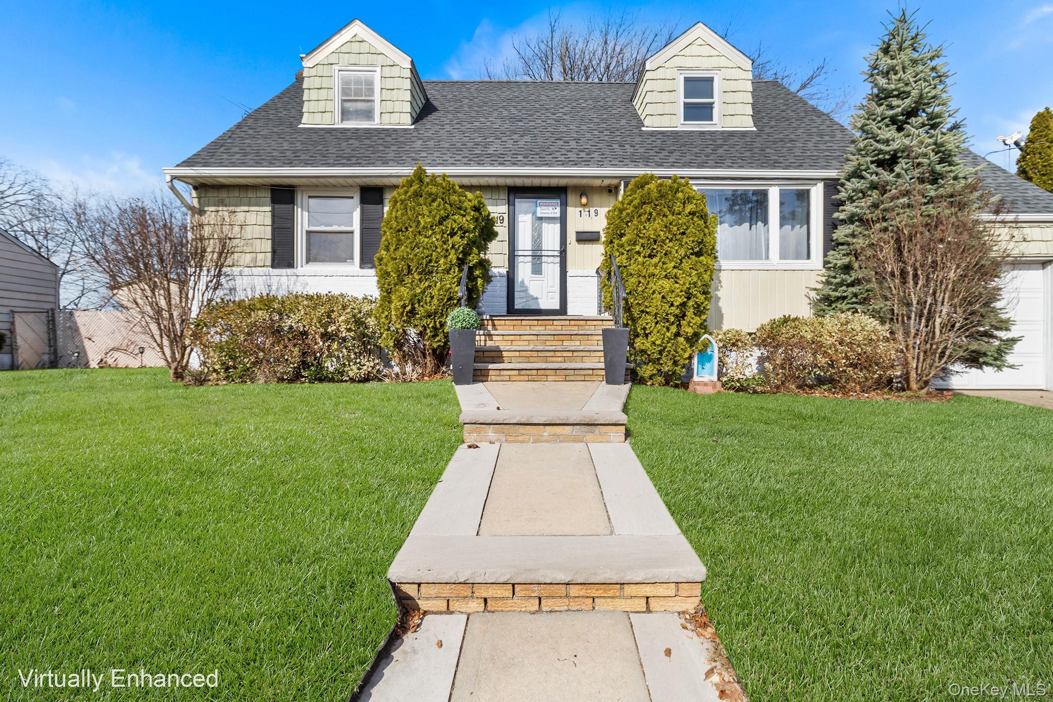 front view of a house with a yard