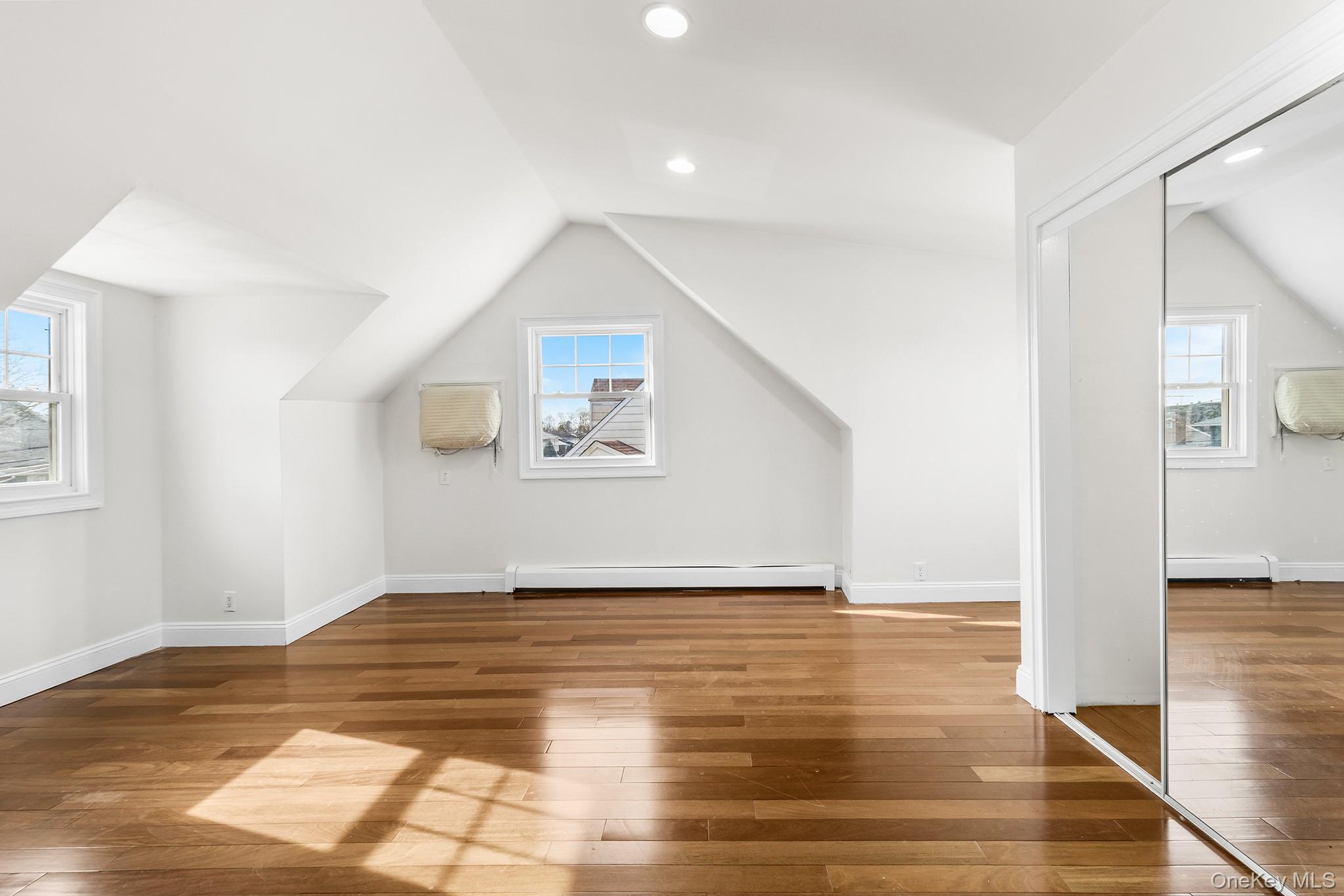 119 Osborne Road West Hempstead, NY 11552 - Photo 20 of 34 a view of empty room with wooden floor and fan