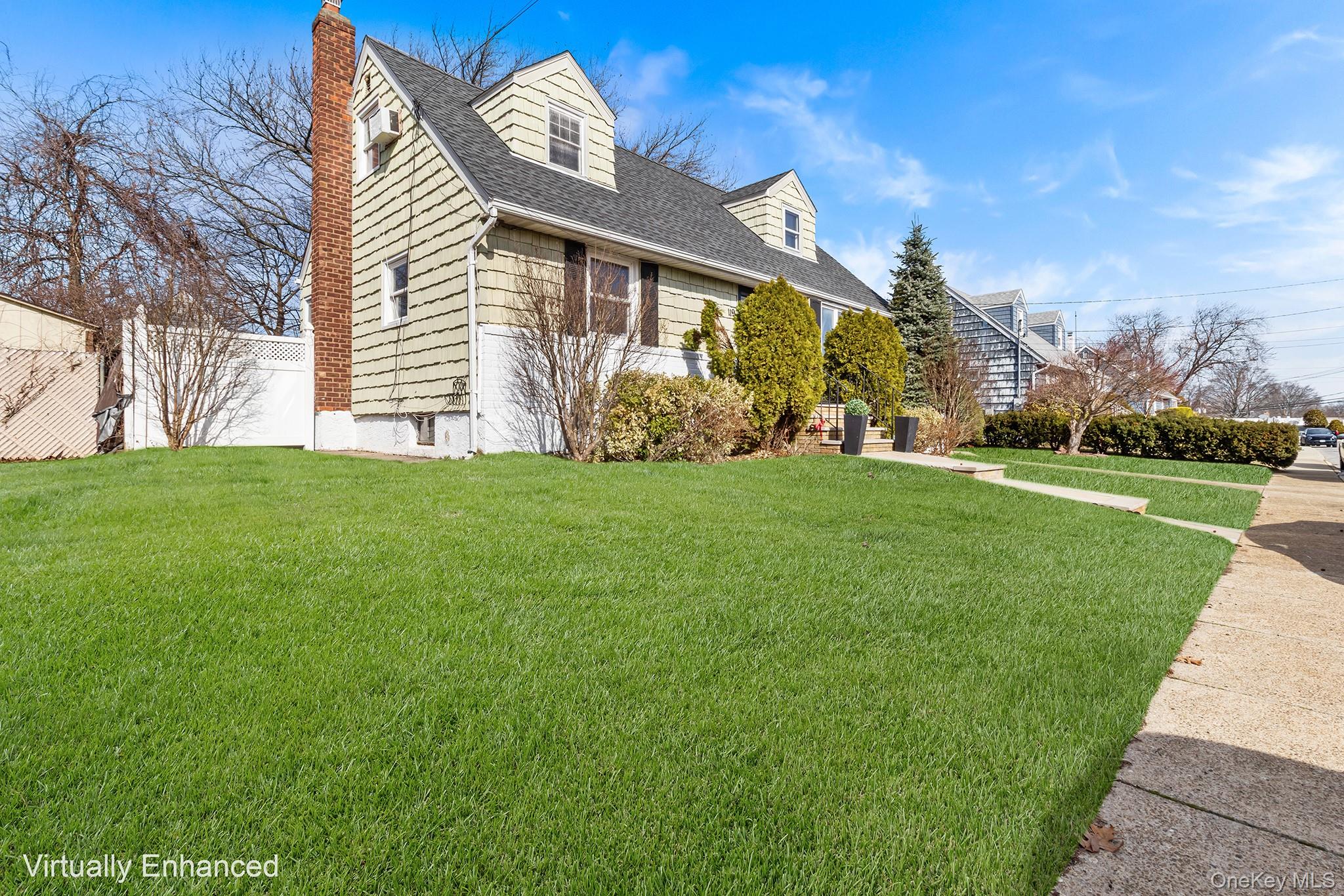 119 Osborne Road West Hempstead, NY 11552 - Photo 2 of 34 a view of a house with a yard