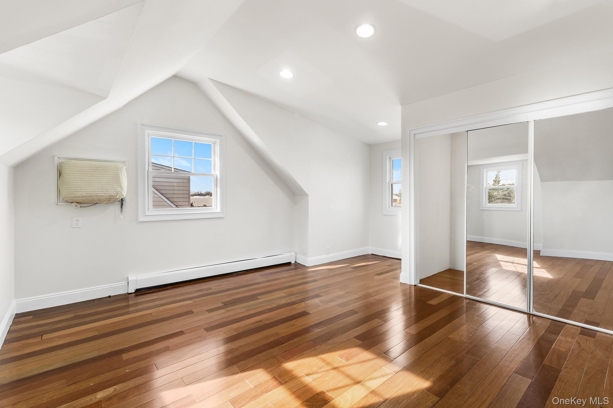 119 Osborne Road West Hempstead, NY 11552 - Photo 21 of 34 a view of empty room with wooden floor