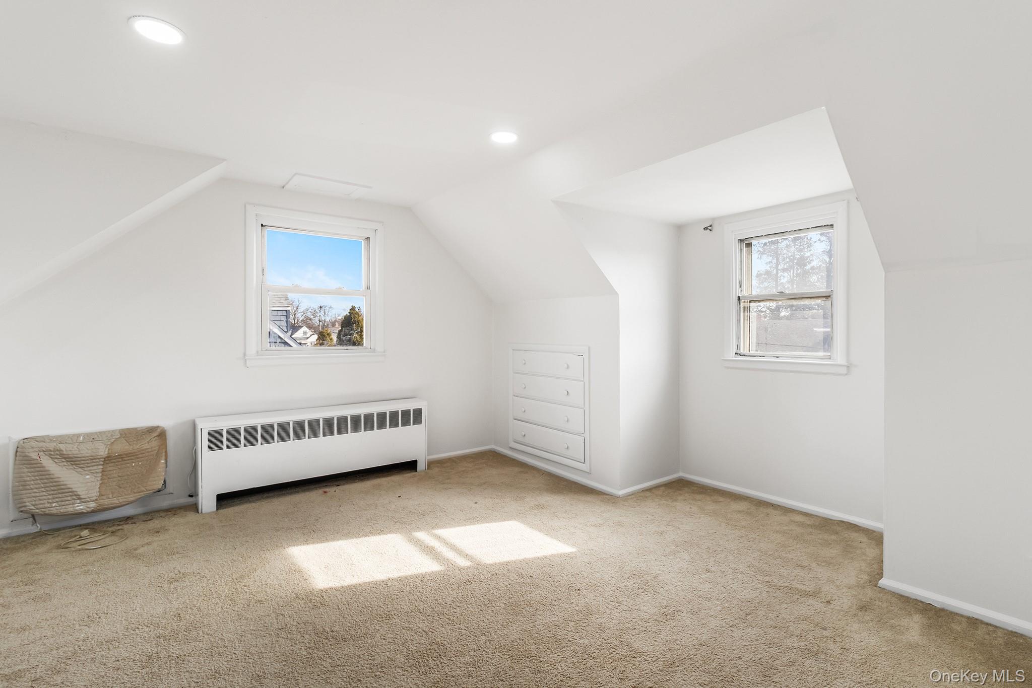 119 Osborne Road West Hempstead, NY 11552 - Photo 23 of 34 a view of an empty room with a window
