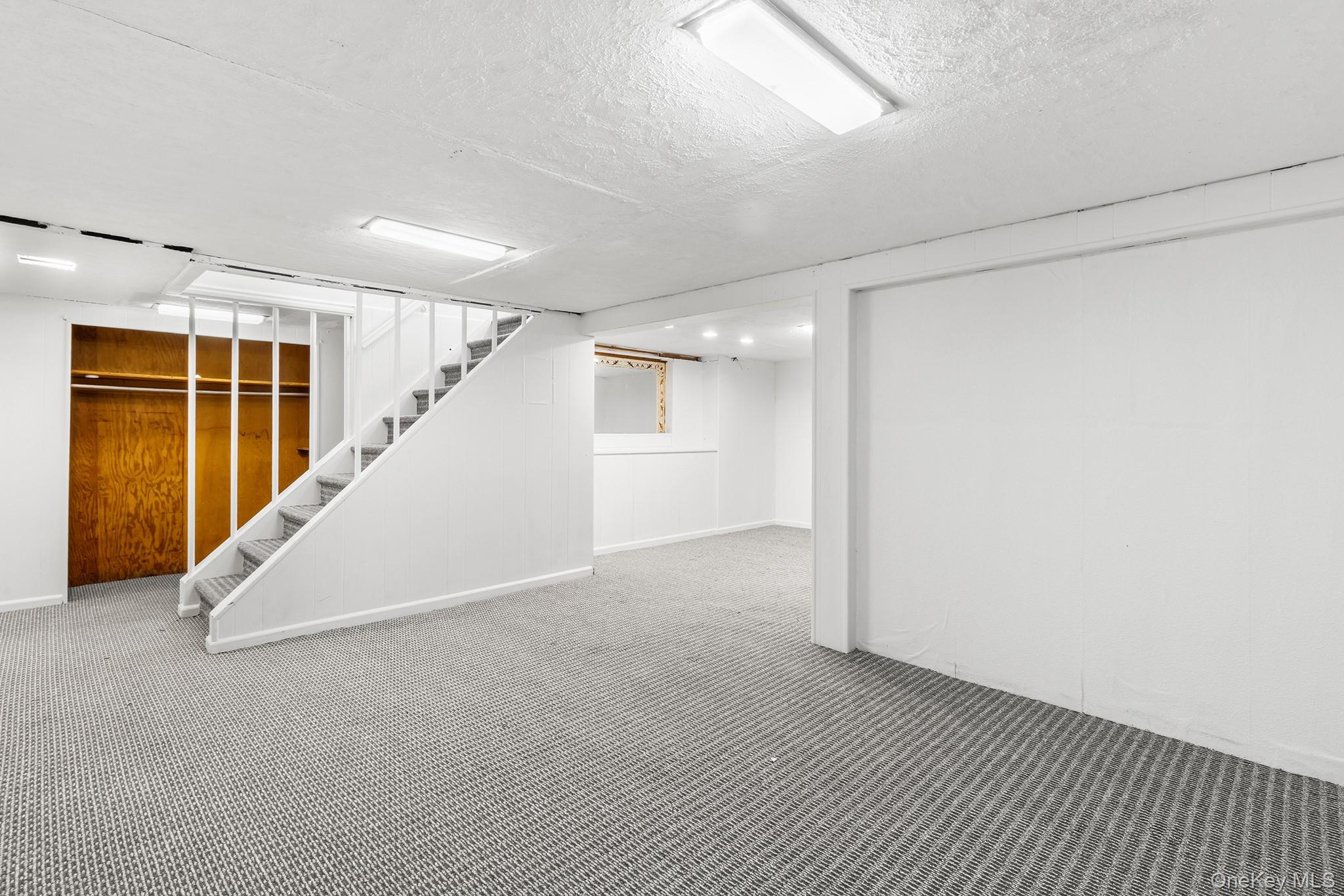 119 Osborne Road West Hempstead, NY 11552 - Photo 27 of 34 a view of an empty room with stairs