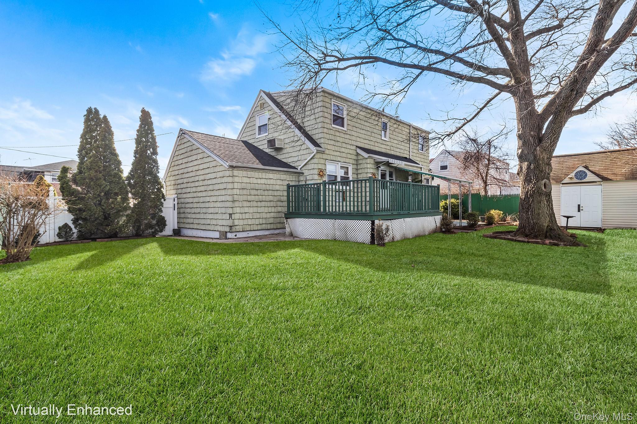 119 Osborne Road West Hempstead, NY 11552 - Photo 33 of 34 a view of a house with a backyard