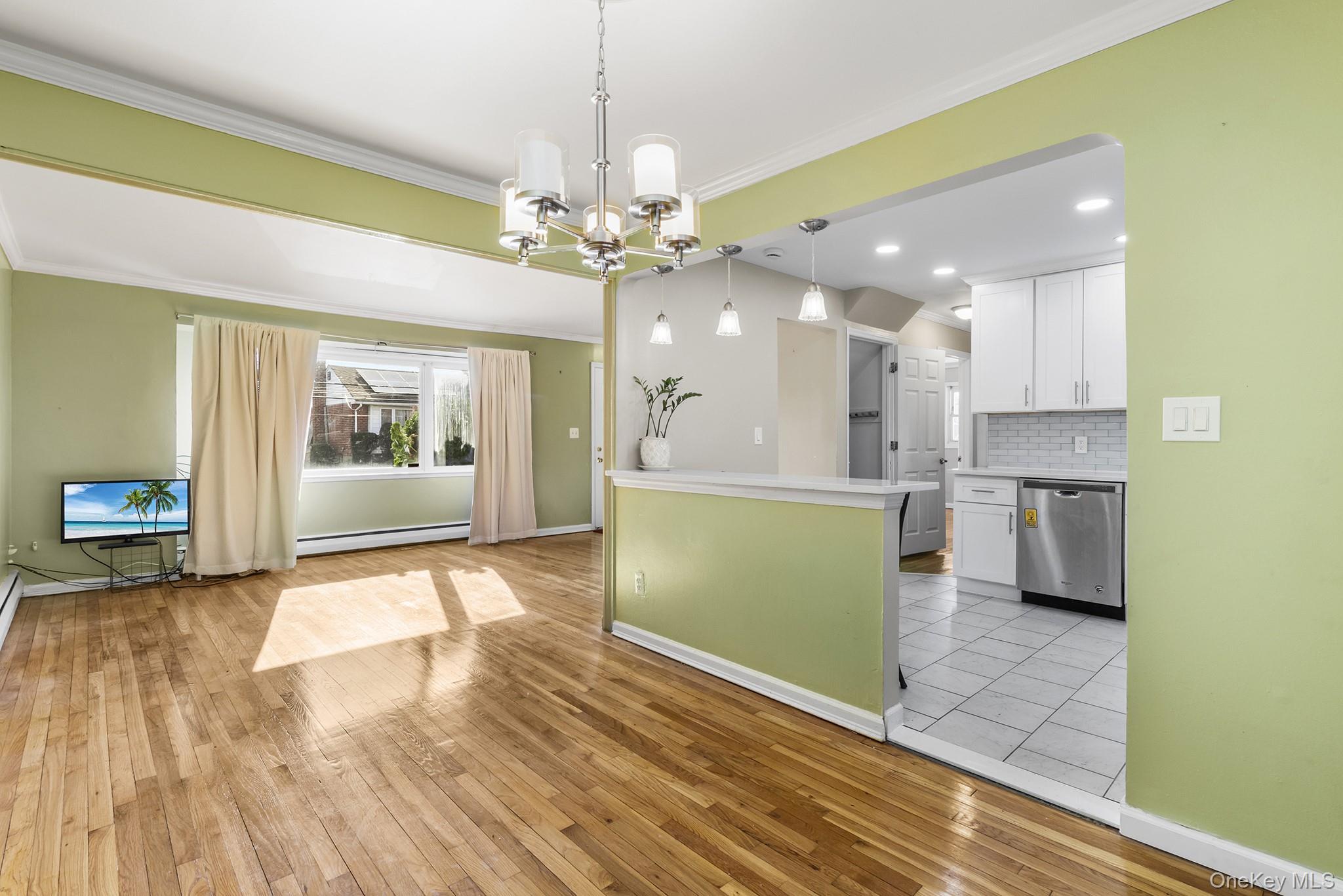 119 Osborne Road West Hempstead, NY 11552 - Photo 7 of 34 a view of a kitchen with a sink a refrigerator and window