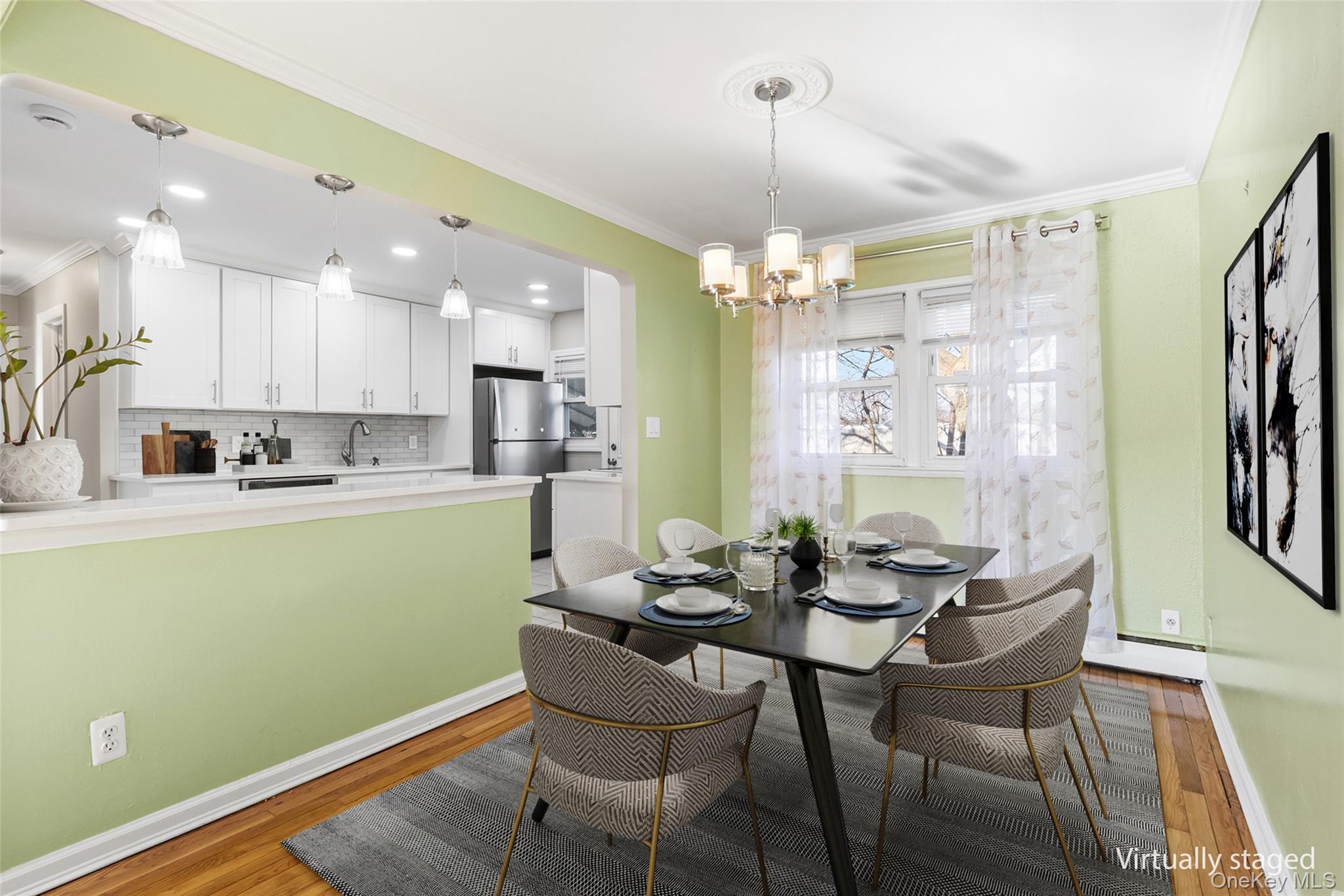 119 Osborne Road West Hempstead, NY 11552 - Photo 8 of 34 a kitchen with a dining table chairs and refrigerator