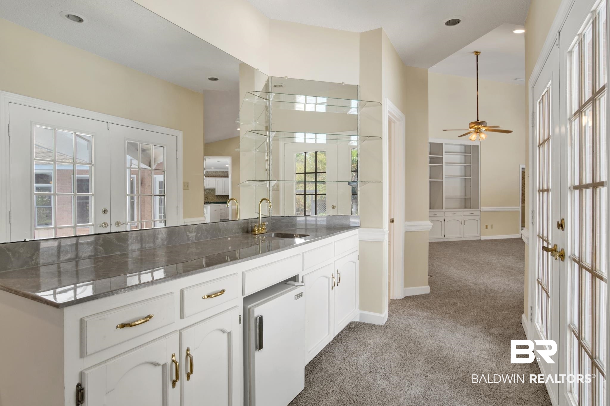 6805 Hunters Court Mobile, AL 36695 - Photo 11 of 37 Kitchen featuring french doors, a sink, light colored carpet, white cabinets, and ceiling fan