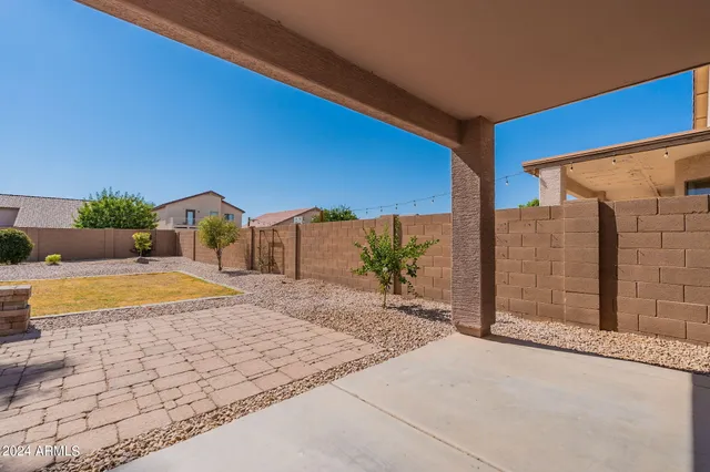 a view of a yard with swimming pool