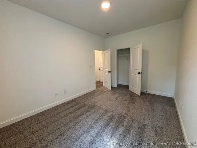 a view of an empty room and wooden floor