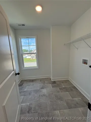 a bathroom with a granite countertop toilet a sink and a mirror