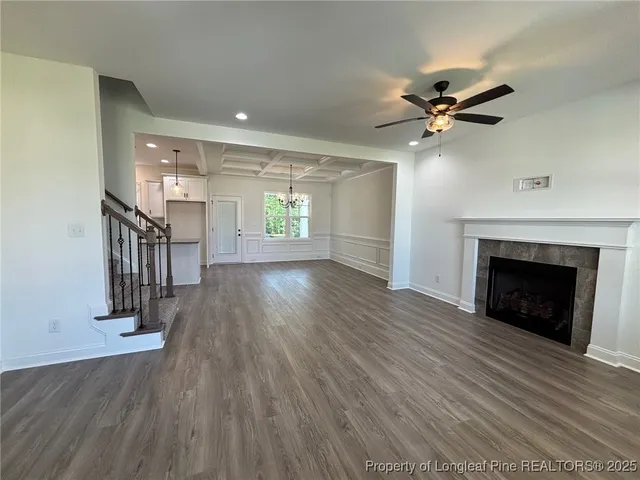 a view of an empty room window and wooden floor