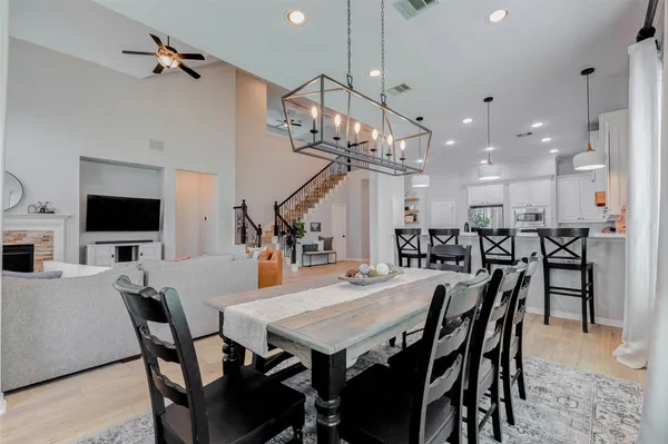 a spacious bathroom with a double vanity sink a mirror a and a shower