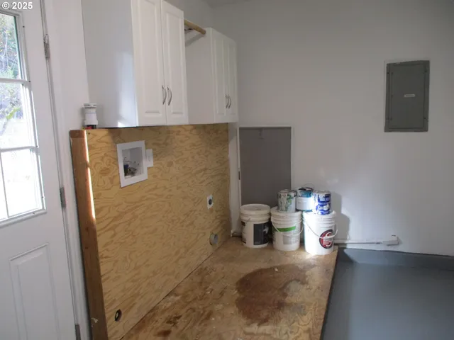 a bathroom with a granite countertop sink a toilet and shower