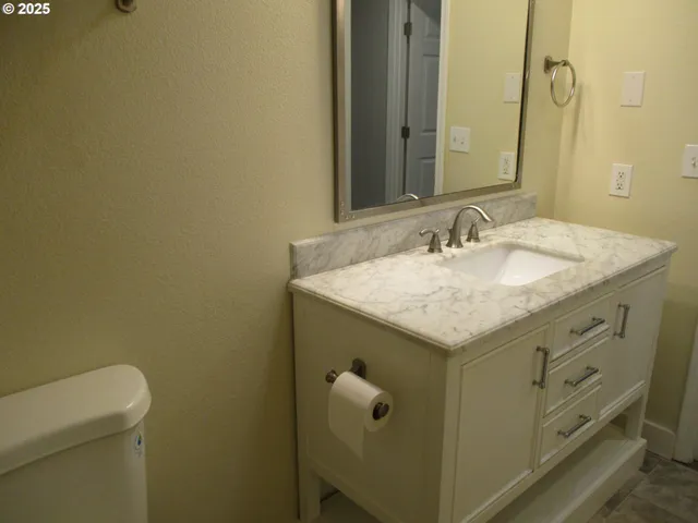 a bathroom with a toilet and shower