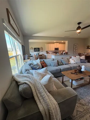 a living room with furniture and a window