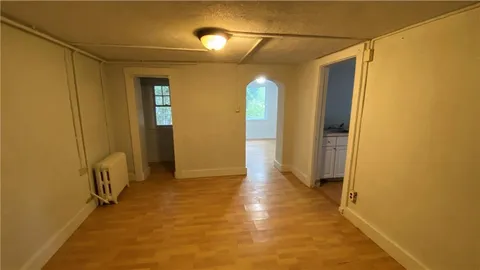 a view of a bathroom with a shower and a tub
