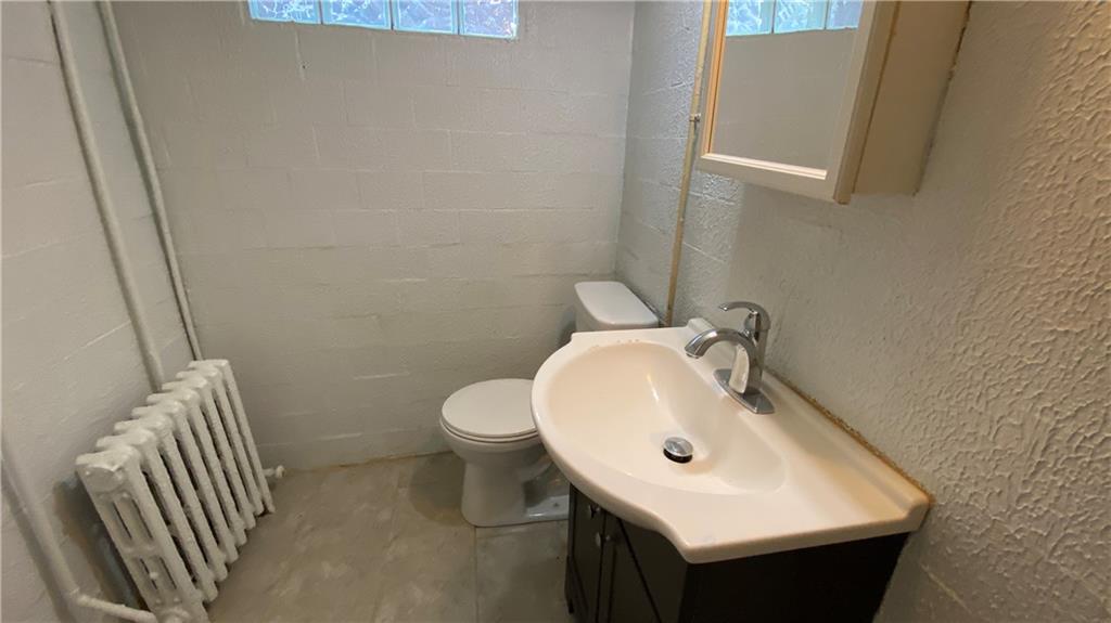 6206 Ira Way Pittsburgh, PA 15217 - Photo 24 of 36 a bathroom with a sink and mirror with toilet